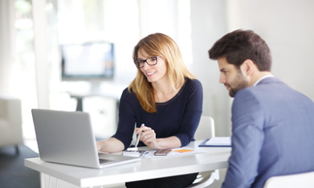 advisor consults with business professional