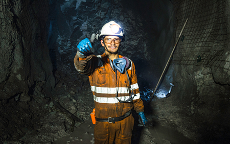 miner inside mine gives thumbs-up