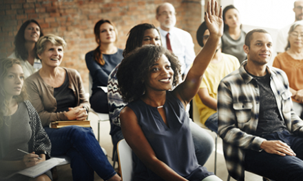 business team meeting with person raising hand