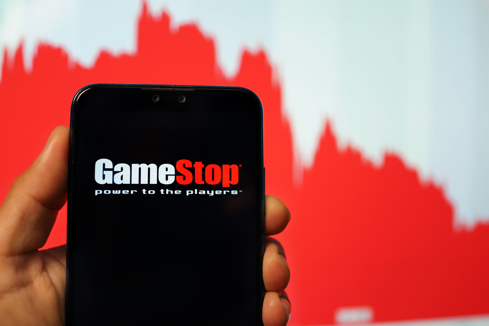 Gamestop logo on phone with stock trending down